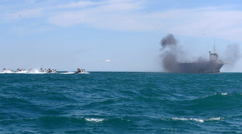 Illustration for article titled Iran Blows Up Gigantic U.S. Carrier Mock-Up During Naval Exercise